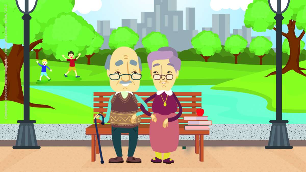 couple de personnes âgées assis sur un banc