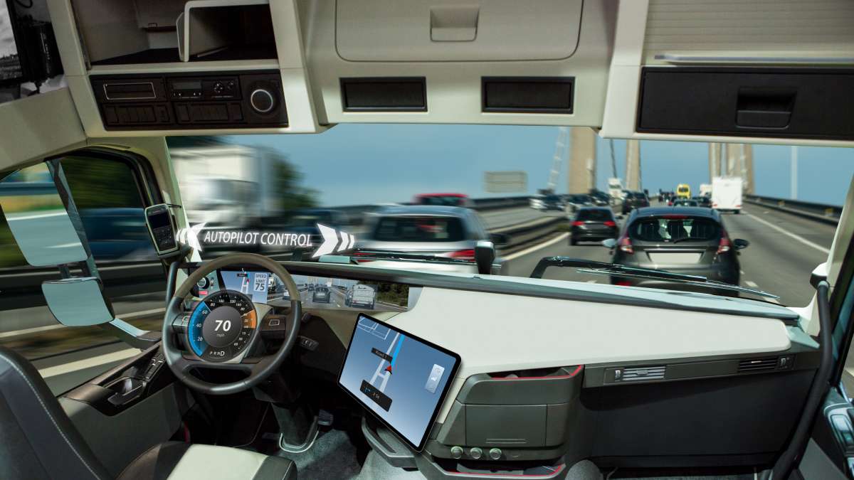 Infographie de l'intérieur d'un camion autonome avec vue de la route
